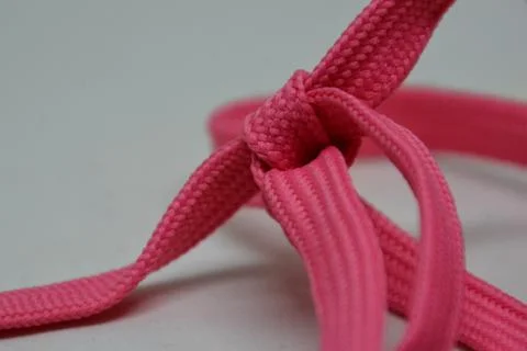 Heart shape rope knot, creative aesthetic romantic candy pink Stock Photos