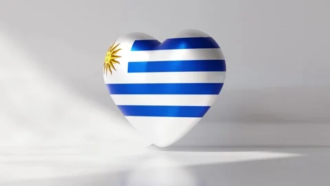 A heart shape rotates seamlessly, showcasing the flag of Uruguay Stock Footage 334740614