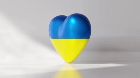 A heart shape rotates while displaying the Ukraine national flag Stock Footage 334740585