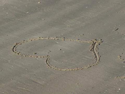 Heart shape on the sand Stock Photos