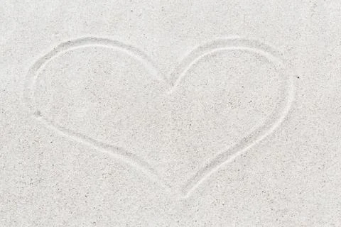 Heart shape on sand Stock Photos