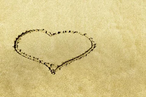 Heart shape on the sandy beach Stock Photos