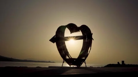 Heart shape silhouette at sunset. Stock Footage 327685710