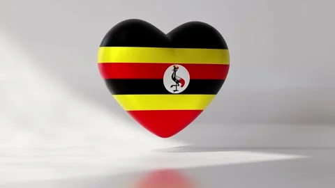 Heart shape spins in a loop with Uganda flag design Stock Footage 334740584