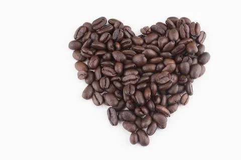Heart shape with stack of coffee beans Stock Photos