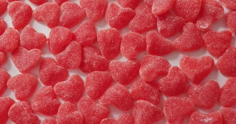 Heart shape sweets on pink background at valentine's day Vídeo Stock 335452613
