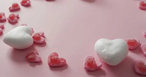 Heart shape sweets on pink background at valentine's day Stock Footage 341088363