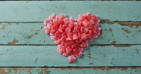Heart shape sweets on wooden background at valentine's day Vídeo Stock 336304606