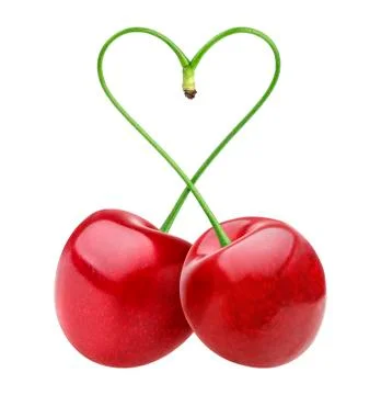 Heart shape from two cherries over white Foto stock