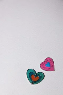 Heart shape on white paper vertical Stock Photos