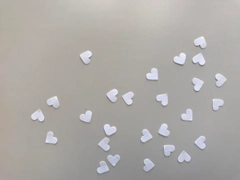 Heart shape white papers on light gray leather, "valentine's day” concept Stock Photos