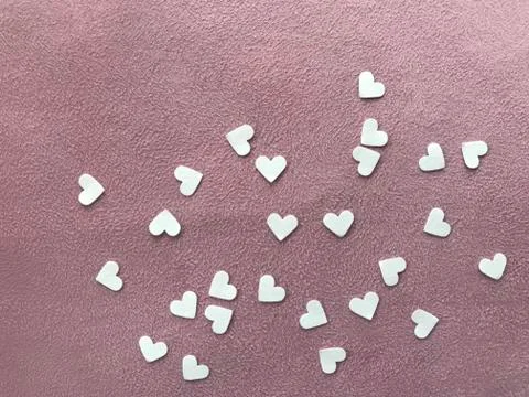 Heart shape white papers on light pink plain fabric, "valentine's day” concept Stock Photos