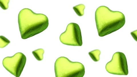 A heart shape wrapped chocolate candy flying and wiggle Stock Footage 168587139