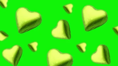 A heart shape wrapped chocolate candy flying and wiggle Stock Footage 168587141