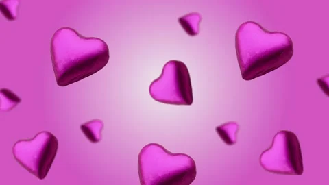 A heart shape wrapped chocolate candy flying and wiggle Stock Footage 168587143