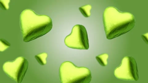 A heart shape wrapped chocolate candy flying and wiggle Stock Footage 168587151