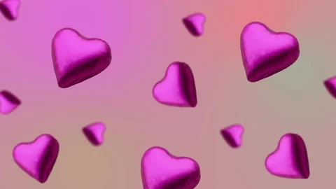 A heart shape wrapped chocolate candy flying and wiggle Stock Footage 168587219