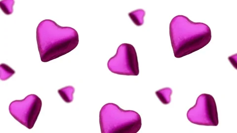 A heart shape wrapped chocolate candy flying and wiggle Stock Footage 168587221