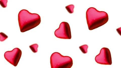 A heart shape wrapped chocolate candy flying and wiggle Stock Footage 168587242