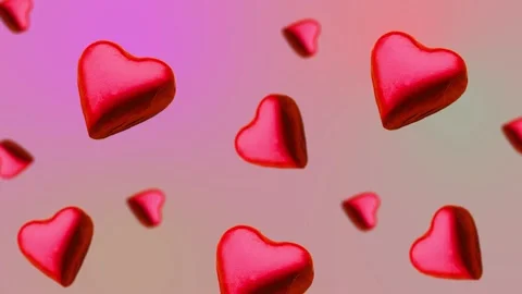 A heart shape wrapped chocolate candy flying and wiggle Stock Footage 168587251