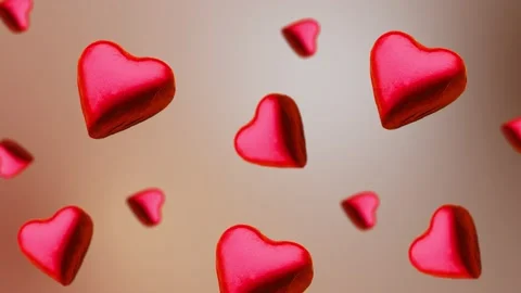 A heart shape wrapped chocolate candy flying and wiggle Stock Footage 168587337
