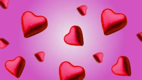 A heart shape wrapped chocolate candy flying and wiggle Stock Footage 168587341