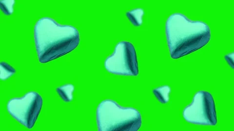 A heart shape wrapped chocolate candy flying and wiggle Stock Footage 168587344