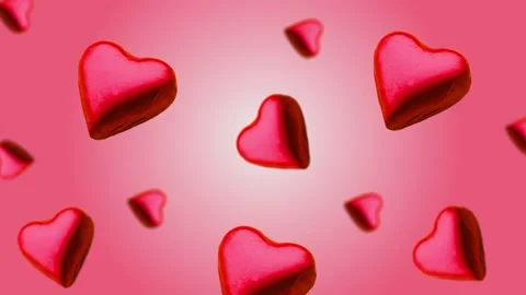 A heart shape wrapped chocolate candy flying and wiggle Stock Footage 168587363