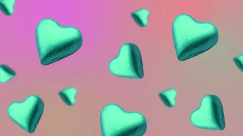 A heart shape wrapped chocolate candy flying and wiggle Stock Footage 168587367