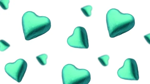 A heart shape wrapped chocolate candy flying and wiggle Stock Footage 168587426
