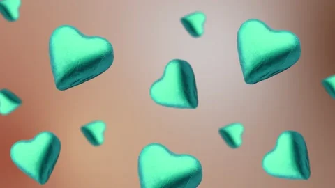 A heart shape wrapped chocolate candy flying and wiggle Stock Footage 168587454