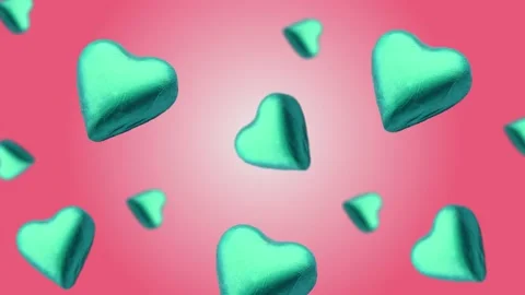 A heart shape wrapped chocolate candy flying and wiggle Stock Footage 168587475