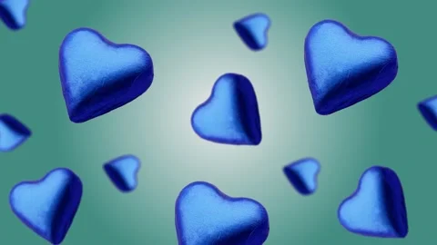 A heart shape wrapped chocolate candy flying and wiggle Stock Footage 168587514