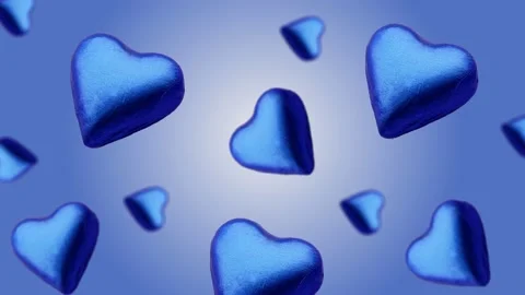 A heart shape wrapped chocolate candy flying and wiggle Video stock 168587572