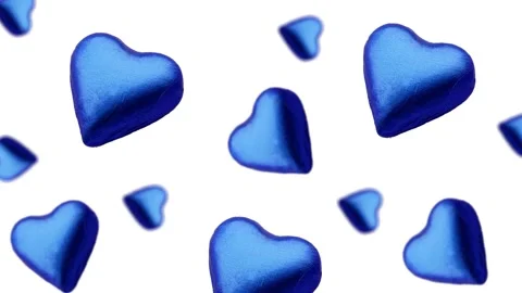 A heart shape wrapped chocolate candy flying and wiggle Video stock 168587581