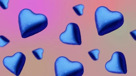 A heart shape wrapped chocolate candy flying and wiggle Stock Footage 168587586