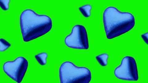 A heart shape wrapped chocolate candy flying and wiggle Stock Footage 168587591