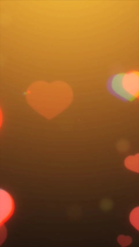 Heart-shaped animations drift gracefully across a warm golden backdrop Video stock 313210174