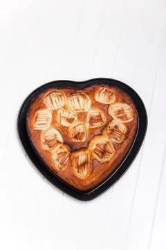 Heart shaped apple pie on white Stock Photos