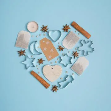 Heart shaped arrangemend made of tea bags, cinnamon sticks, anise seeds, cand Stock Photos
