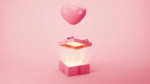 Heart shaped balloon floating from glowing pink gift box on studio background Stock Footage 327524465
