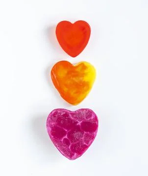 Heart shaped bars of soap on a light soft background. Top view. Stock Photos