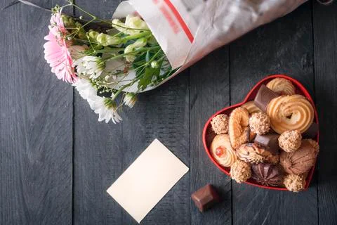 Heart-shaped box with sweets Stock Photos