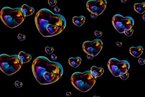 Heart-shaped bubbles on black background Stock Illustration