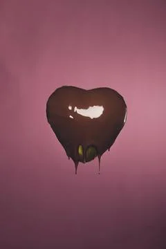 Heart shaped candy golden wrapper Stock Photos