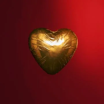 Heart shaped candy golden wrapper 写真素材
