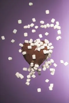 Heart shaped chocolate candy falling Stock Photos