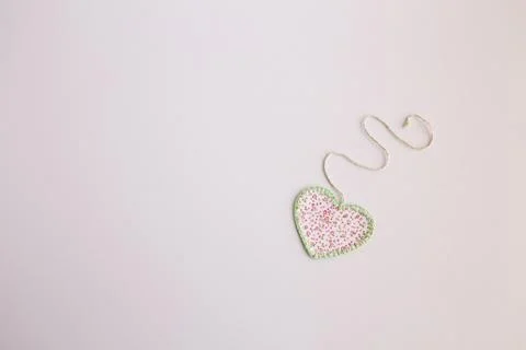 Heart-shaped cloth patch on white background Stock Photos