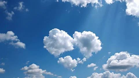 Heart-shaped cloud floats high across bright blue sky Stock Footage 317167430