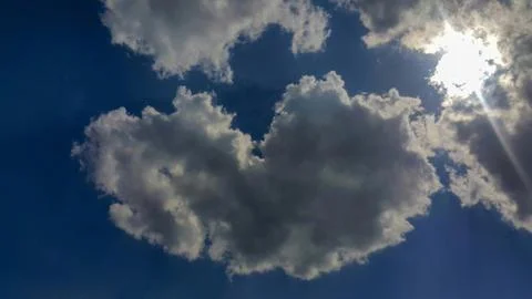 Heart-shaped clouds Stock Photos